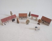 Set of white, hand-painted vintage toys, wooden farm stable blocks, trees, and a horse, packed in an old cigar box, sophisticated toy decor