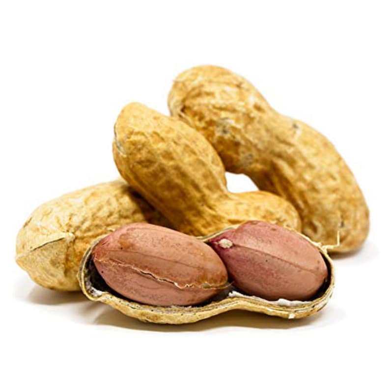 Peut inclure: Gros plan sur des cacahu&egrave;tes dans leurs coques. Les coques sont de couleur brun clair et les cacahu&egrave;tes &agrave; l'int&eacute;rieur sont de couleur brun rouge&acirc;tre.