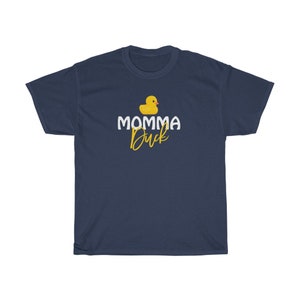 May include: Navy blue t-shirt featuring a yellow rubber duck and the text "MOMMA Duck" in white.