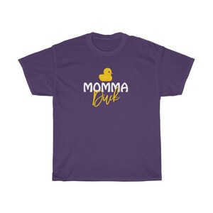 May include: Purple t-shirt featuring a yellow rubber duck and the text "Momma Duck" in white and yellow lettering.