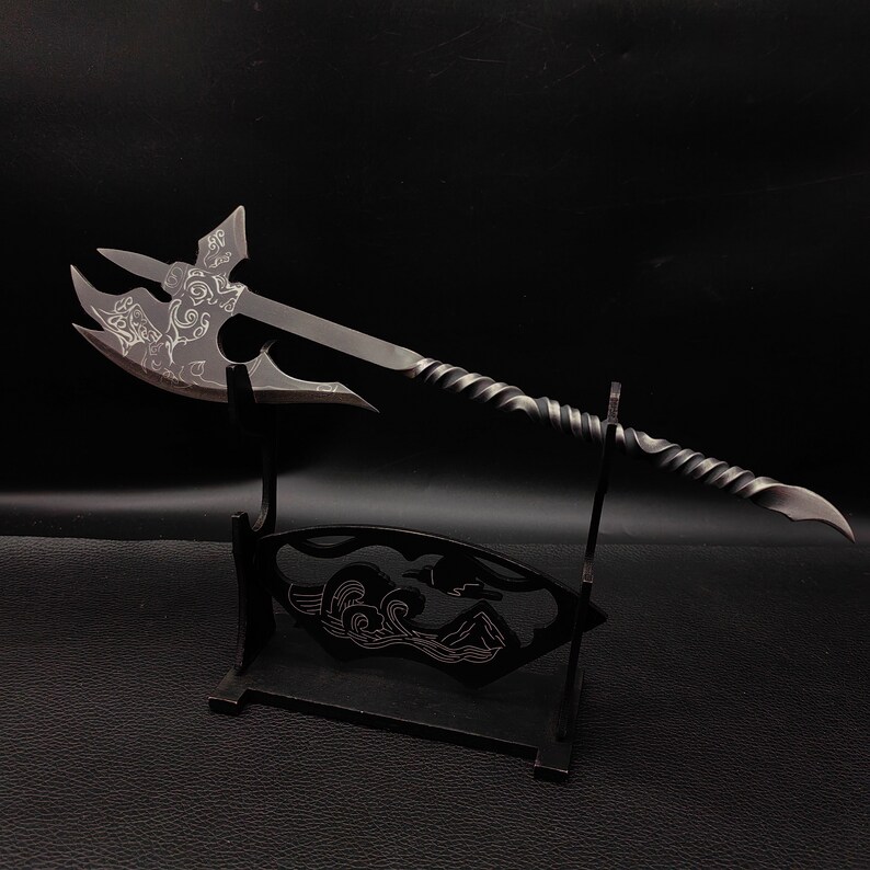 May include: A black metal axe with a twisted handle and intricate designs on the blade. The axe is displayed on a black stand with a wave design.