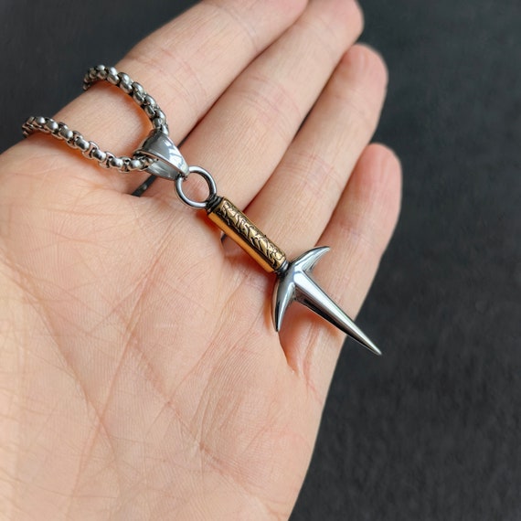 snootyfoxfashion — Cross Pocket Knife Necklace from contrary