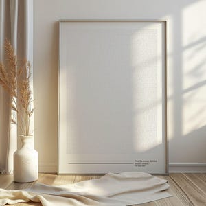 May include: A framed print with a minimalist design. The print features rows of small text in a light colour, set against a white background. The frame is silver. The text at the bottom reads "THE ORIGINAL SERIES".