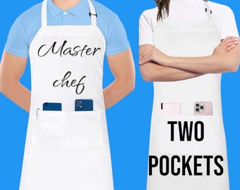 May include: Two white aprons with black text. One apron says "Master chef" and the other says "TWO POCKETS".