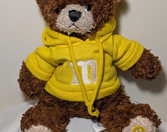 Peluche ours en peluche jaune bonbon M&M World de 30,5 cm (12 po.) à capuche à collectionner