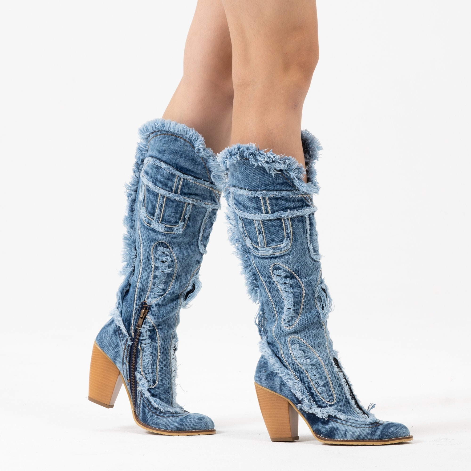 Do people prefer wearing boots with their jeans tucked in or out? - Quora