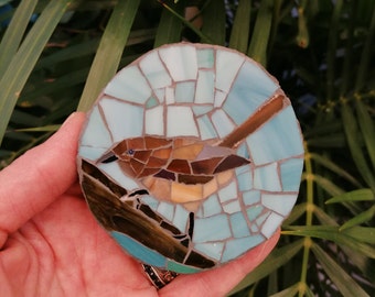 Round mosaic with a sparrow bird for wall decoration