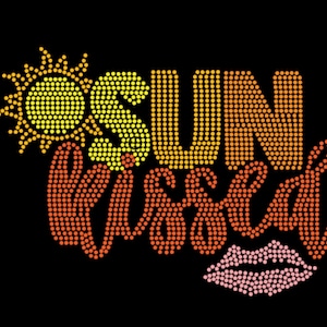 May include: A graphic design on a black background featuring the text SUN KISSED in a gradient of yellow to orange rhinestones. A yellow sun icon is positioned to the left of the word SUN, and a pink rhinestone lip icon is below the word KISSED.