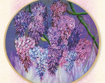 May include: A bead embroidery kit featuring a close-up of a purple and pink wisteria flower design. The kit includes 7,767 beads and 18 colors. The size of the design is 12.9 inches by 12.9 inches. The kit does not include hoops.