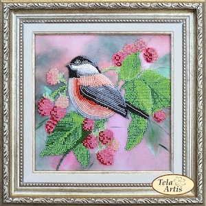May include: A beaded artwork depicting a small bird perched on a branch of a raspberry bush. The bird is black, white, and orange, and the raspberries are pink and green. The background is a soft pink.