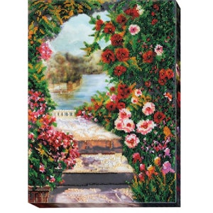 May include: A beaded artwork depicting a garden scene with a stone walkway leading to a lake. The artwork features a variety of flowers in shades of red, pink, and white, as well as green foliage.