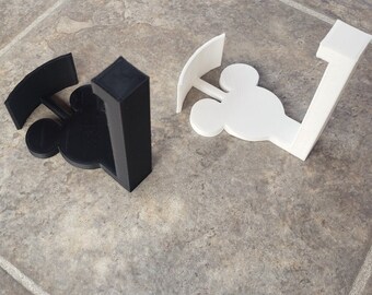 May include: Two 3D printed Mickey Mouse head wall hooks, one black and one white.  ***adhesive strips and screws not included***
