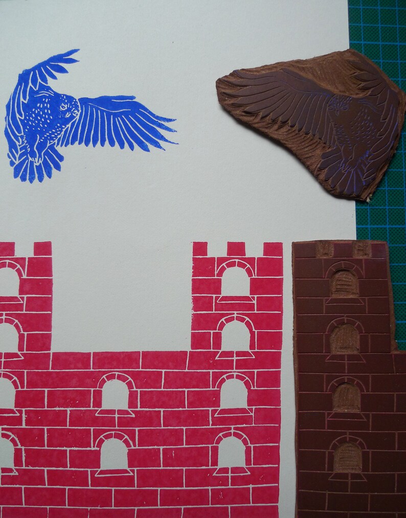 May include: A set of three woodblock printing stamps. The stamps are used to create a castle scene with a red brick wall and arched windows. The third stamp is a brown bird with outstretched wings.