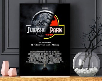 May include: A black and white poster with a red and yellow Jurassic Park logo. The logo features a dinosaur silhouette and the text "Jurassic Park". The poster also includes the text "An Adventure 65 Million Years In The Making".