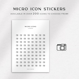 Könnte beinhalten: Ein Blatt weißes Papier mit einem Raster von 100 kleinen Kamera-Symbolen. Die Symbole sind schwarzweiß und in einem 10x10-Raster angeordnet. Der Text "MICRO ICONS" und "CAMERA" ist oben auf dem Blatt gedruckt. Der Text "DAISY PAPERS" ist unten auf dem Blatt gedruckt.