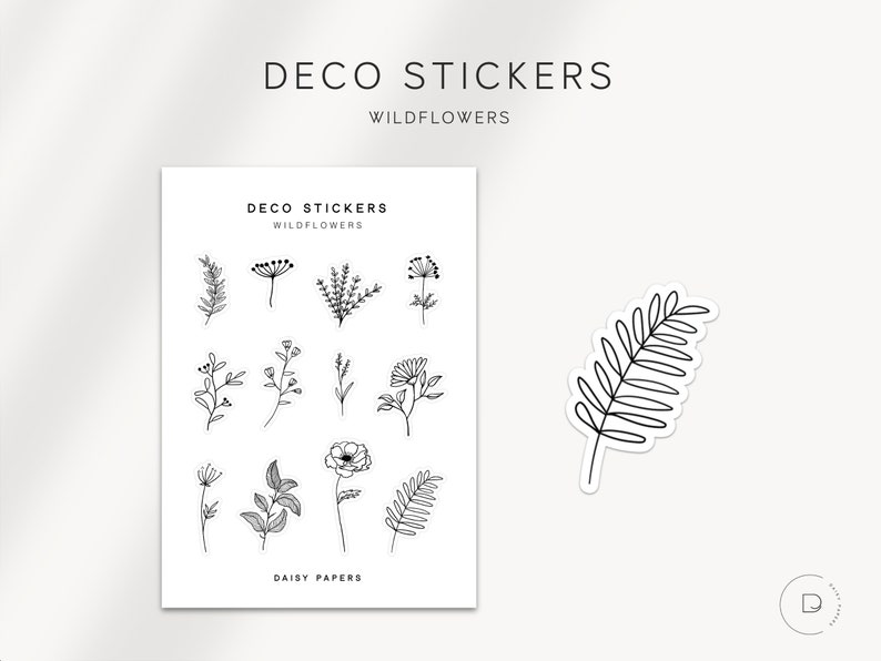 May include: A sheet of black and white line art stickers featuring wildflowers and a single fern leaf. The stickers are labelled "Deco Stickers Wildflowers Daisy Papers".