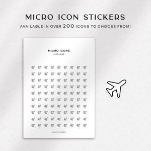 May include: A sheet of white paper with a grid of 100 small airplane icons. The icons are black and white and are arranged in a 10x10 grid. The text "MICRO ICONS" and "AIRPLANE" is printed at the top of the sheet. The text "DAISY PAPERS" is printed at the bottom of the sheet.