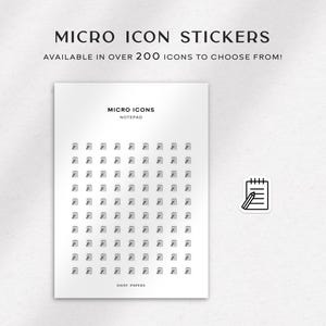 May include: A sheet of white paper with a grid of small black and white icons. The icons are arranged in a 10x10 grid. The text "MICRO ICONS" and "NOTEPAD" is printed at the top of the sheet. The text "DAISY PAPERS" is printed at the bottom of the sheet.