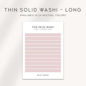 May include: A long strip of powder pink washi tape. The tape is thin and has a solid colour. The text "THIN SOLID WASHI LONG | POWDER PINK" is printed on the tape. The text "DAISY PAPERS" is printed at the bottom of the tape.