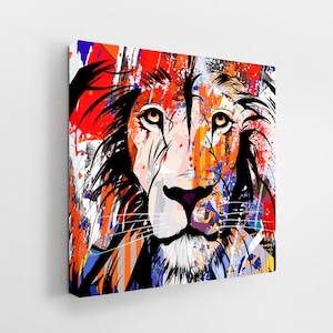 May include: A colourful abstract painting of a lion's face with a splash of paint background. The lion's face is in the centre of the painting and is surrounded by a variety of colours, including red, orange, yellow, blue, and green.
