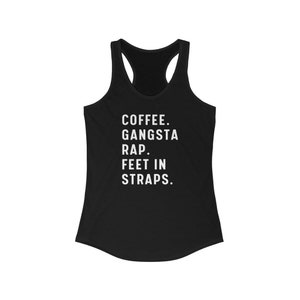 May include: Black racerback tank top with white text that reads "COFFEE. GANGSTA RAP. FEET IN STRAPS."