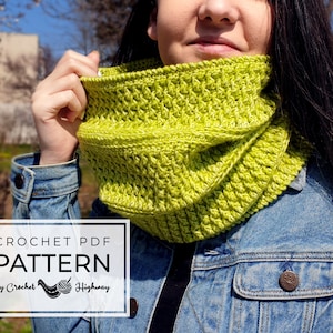 May include: A lime green crochet cowl neck scarf. The scarf is folded and worn by a person. The text "CROCHET PDF PATTERN by Crochet Highway" is on the image.