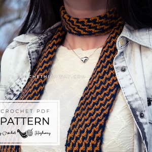 May include: A crochet scarf and neck warmer set in a chevron pattern, featuring navy blue and orange-brown colors. The image includes the text "CROCHET PDF PATTERN by Crochet Highway". The scarf is worn with a denim jacket.