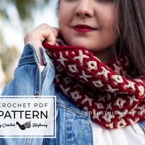 May include: A crochet cowl neck warmer in red and cream with a geometric pattern. The cowl is worn by a person wearing a denim jacket. The text "CROCHETHIGHWAY.COM" is visible on the cowl. The text "CROCHET PDF PATTERN by Crochet Highway" is visible in the lower left corner of the image.