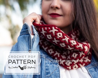 May include: A crochet cowl neck warmer in red and cream with a geometric pattern. The cowl is worn by a person wearing a denim jacket. The text "CROCHETHIGHWAY.COM" is visible on the cowl. The text "CROCHET PDF PATTERN by Crochet Highway" is visible in the lower left corner of the image.