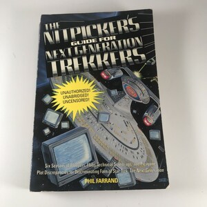 May include: A book cover with a black background and a spaceship in the center. The title is "The Nitpickers Guide for Next Generation Trekkers" and the subtitle is "Unauthorized! Unabridged! Uncensored!" The book is about the TV show Star Trek: The Next Generation.
