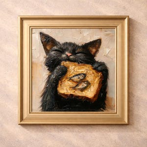 May include: A framed oil painting depicts a black cat joyfully holding a piece of toast with two fish on it. The cat's eyes are closed, and its fur is textured. The painting is in a gold frame, set against a neutral background.