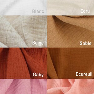 May include: A close-up of ten different fabric swatches in various colors, including white, beige, brown, orange, pink, and red. The swatches are arranged in a grid pattern and labeled with their corresponding color names in French.