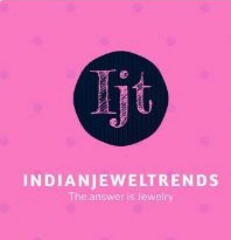 May include: A square graphic with a bright pink background featuring a subtle polka dot pattern. In the center, a dark navy blue circle contains the stylized pink letters Ijt. Below, the text INDIANJEWELTRENDS appears with The answer is Jewelry.