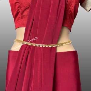 Deepika Padukone in Sabyasachi Stylish Waist Belt Tiger Logo.28-40