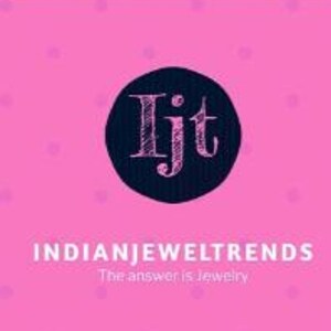May include: A black circle with the letters "Ijt" in white inside. The text "INDIANJEWELTRENDS" is below the circle in black text. The text "The answer is Jewelry" is below the text "INDIANJEWELTRENDS" in smaller black text.