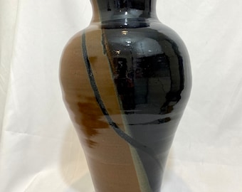 Dark blue and rust vase with black swish.