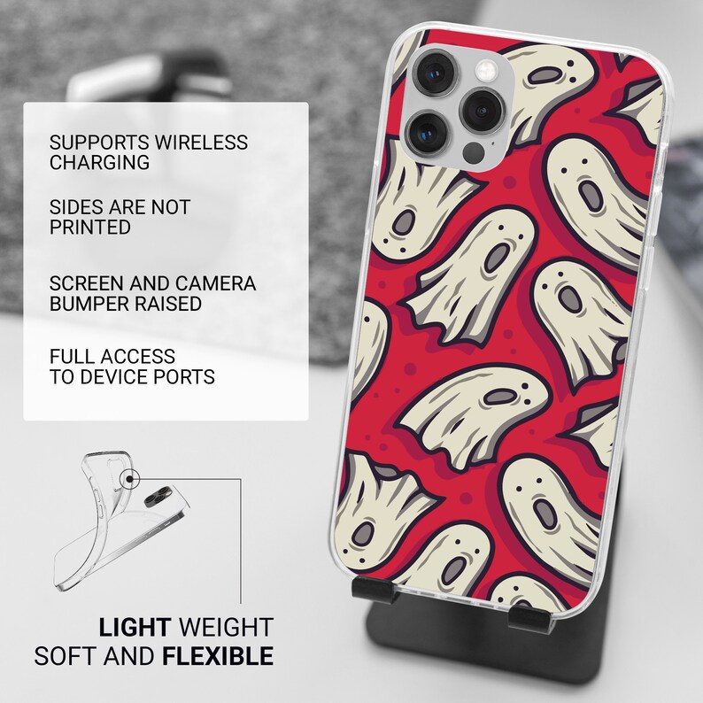 May include: A clear phone case with a red background and a pattern of white ghosts. The case is designed for a phone with a raised camera bump. The text "SUPPORTS WIRELESS CHARGING", "SIDES ARE NOT PRINTED", "SCREEN AND CAMERA BUMPER RAISED", "FULL ACCESS TO DEVICE PORTS", "LIGHT WEIGHT SOFT AND FLEXIBLE" is printed on the case.