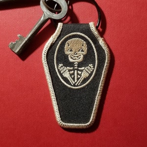 SKELETON COFFIN KEYCHAIN