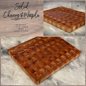 May include: A solid cherry and maple cutting board with a juice groove. The board is 1 1/2 inches thick and has a checkered pattern.