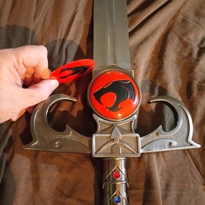 Thundercats Metallic version of sword of omens, crossguard upgrade. EMBLEMS ONLY