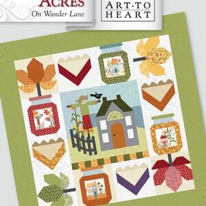 May include: A quilt block pattern featuring a farmhouse with a scarecrow, jars of preserves, and fall foliage. The block is titled "Harvest Acres" and is part of the "Art-to-Heart" collection. Block #11.