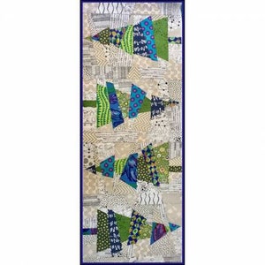 May include: A rectangular quilted wall hanging with a dark blue border. The design features several abstract Christmas tree shapes in shades of green, blue, and patterned fabrics. The background is a patchwork of neutral-toned fabrics with printed text and geometric patterns.