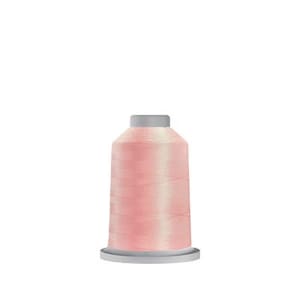 May include: A spool of pale pink thread for sewing or embroidery.