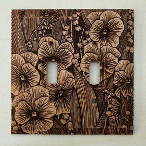 May include: A set of three ceramic mugs with a speckled, matte finish. The mugs are in shades of cream, light gray, and dark gray. Each mug has a simple, minimalist design, perfect for coffee or tea.