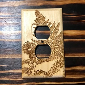 Wooden fern outlet cover
