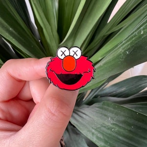 KAWS x Sesame Street Elmo Enamel Pin