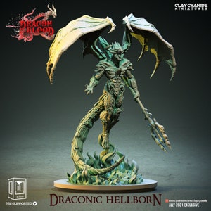 May include: A green and gold dragon-like creature with wings, a spear, and a tail made of flames. The creature is standing on a circular base. The text "DRACONIC HELLBORN" is printed on the base.
