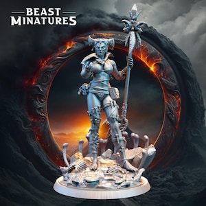 May include: A silver painted miniature figurine of a female warrior with horns, holding a staff with a feathered top. She is standing on a base with a rocky texture and skeletal remains. The background is a blurry image of a fiery ring.