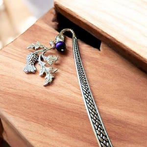 Celtic style silver book hook featuring silver thistle and crystal amethyst bead.