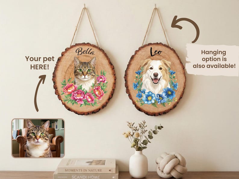 May include: Two personalized pet portraits on wood slices. One features a cat named Bella surrounded by pink flowers, the other a dog named Leo with blue flowers. Both are hanging with twine. The text "Your pet HERE!" is also visible.